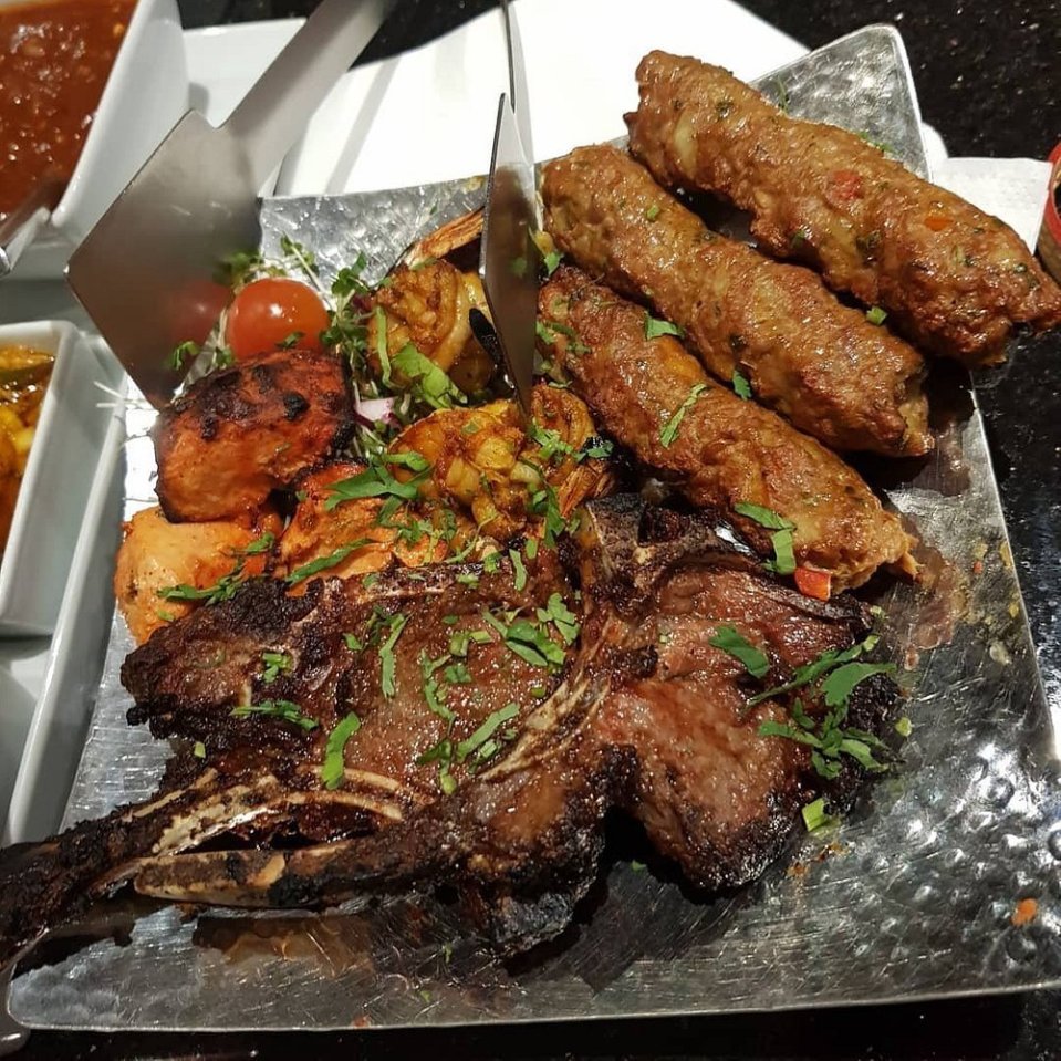 Grilled meats and shrimp platter.