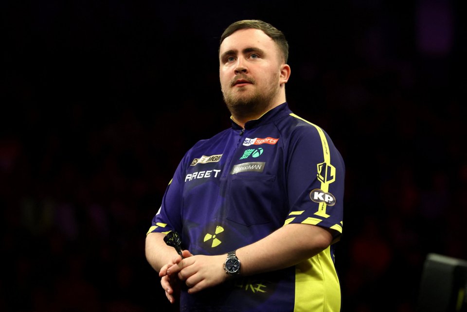 Luke Littler at a darts tournament.