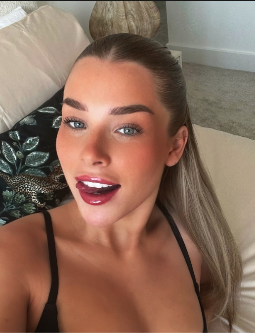 Selfie of a woman sticking her tongue out.
