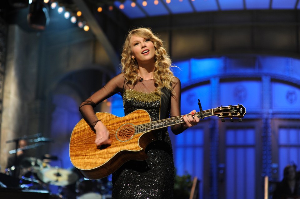 Taylor Swift playing guitar on Saturday Night Live.