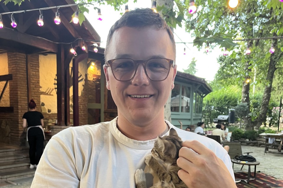 Man holding a kitten.