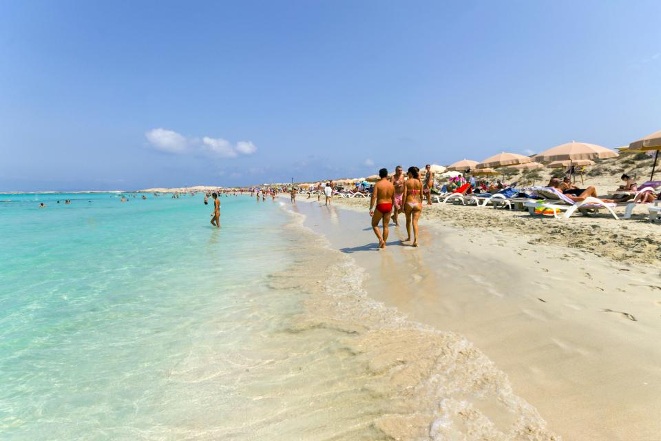 Crowded beach in Formentera, Spain.