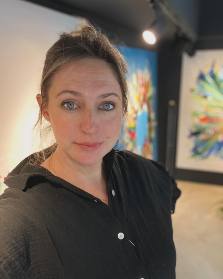 Portrait of a woman in a black shirt.