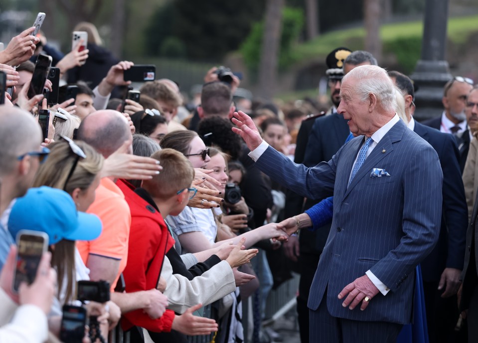 King Charles III greets well-wishers.