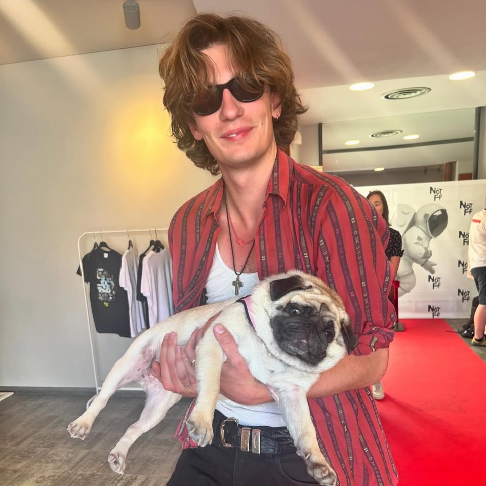 Man holding a pug.