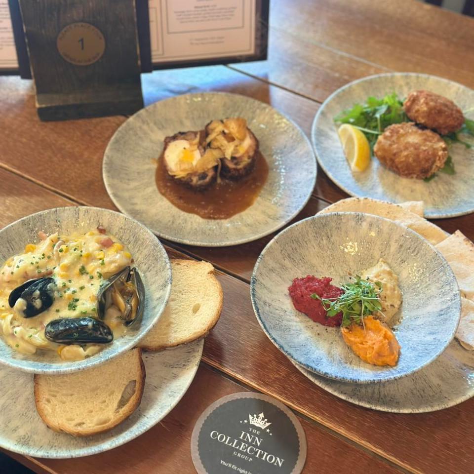 Assortment of small plates of food.