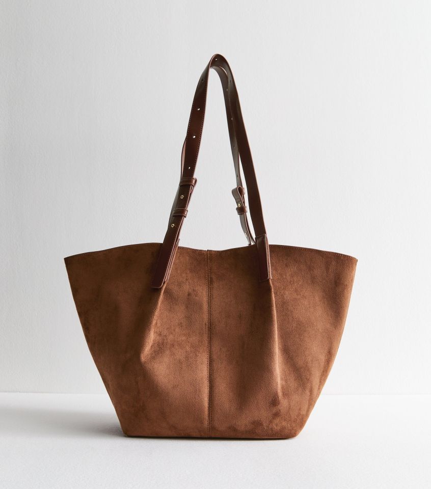 Brown suede tote bag with brown leather straps.