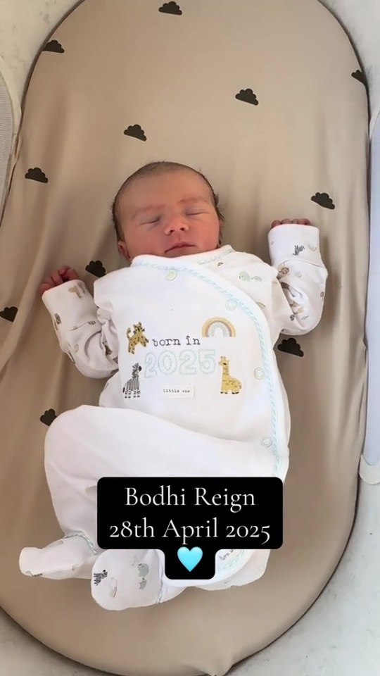Newborn baby Bodhi Reign sleeping in a bassinet.