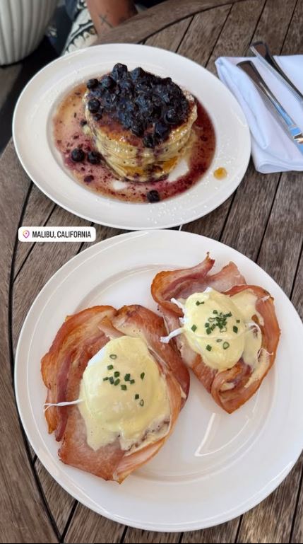 Two plates of breakfast food: blueberry pancakes and eggs benedict.