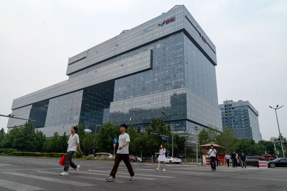 Pedestrians crossing the street in front of the JD.com headquarters in Beijing.