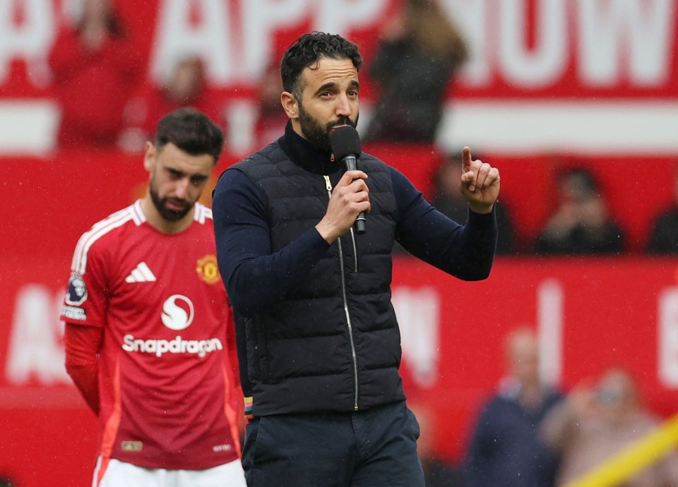 Manchester United manager Ruben Amorim addressing fans with a microphone.