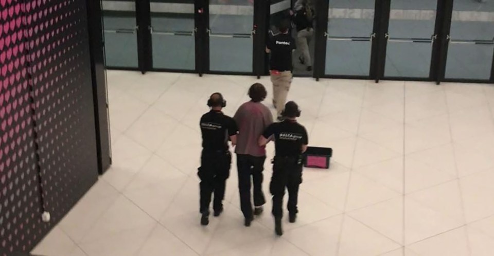 Three Youth Demand protestors being detained by security at the Eurovision Song Contest.