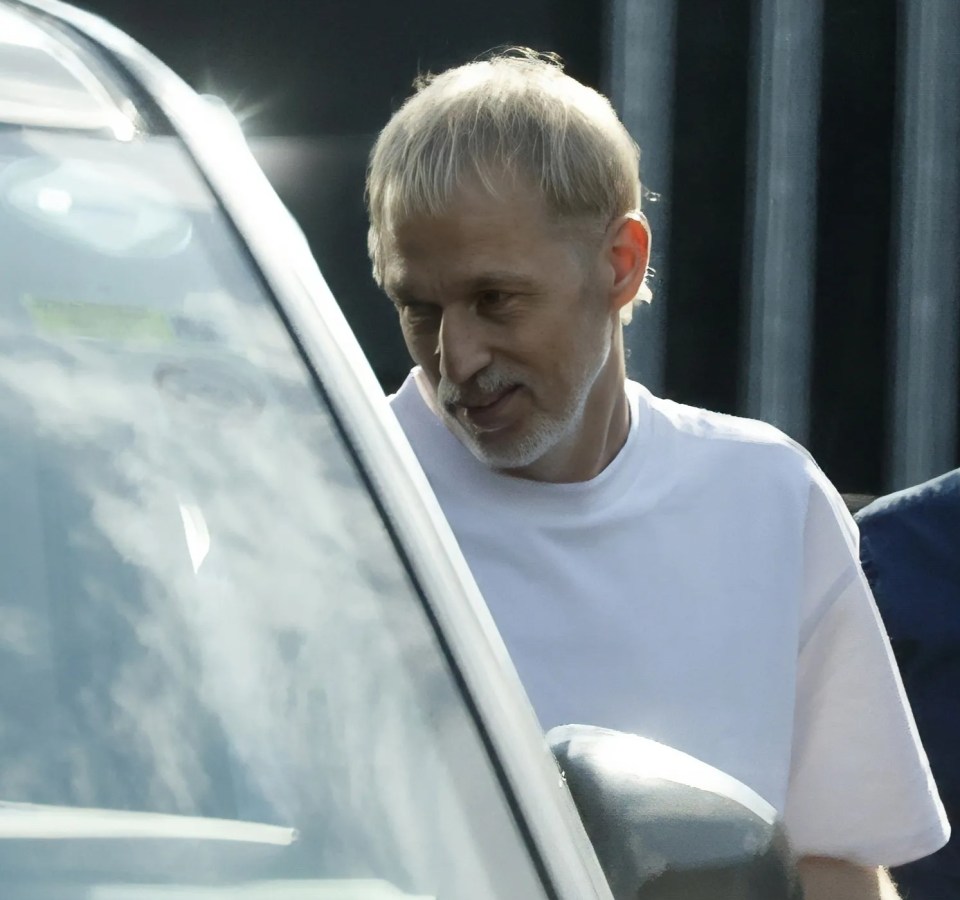 Oasis band members arriving at a rehearsal.