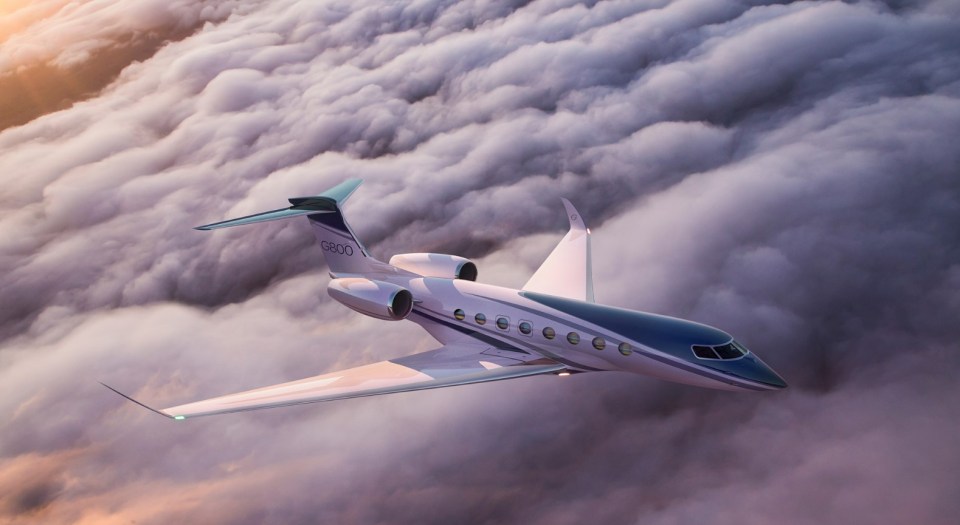 Private jet flying above the clouds.