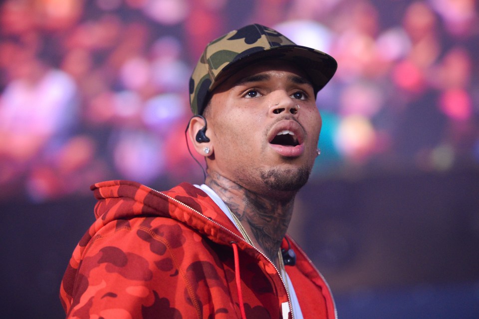 Chris Brown performing on stage.