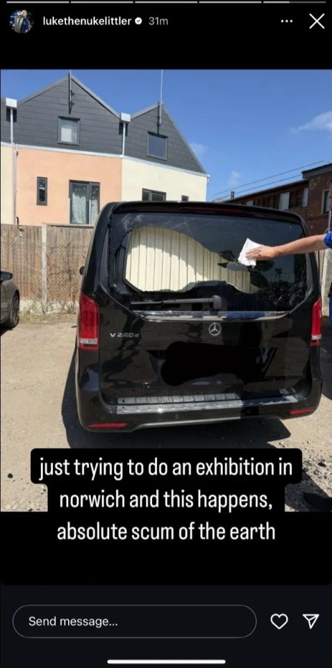 Black van with a broken rear window.