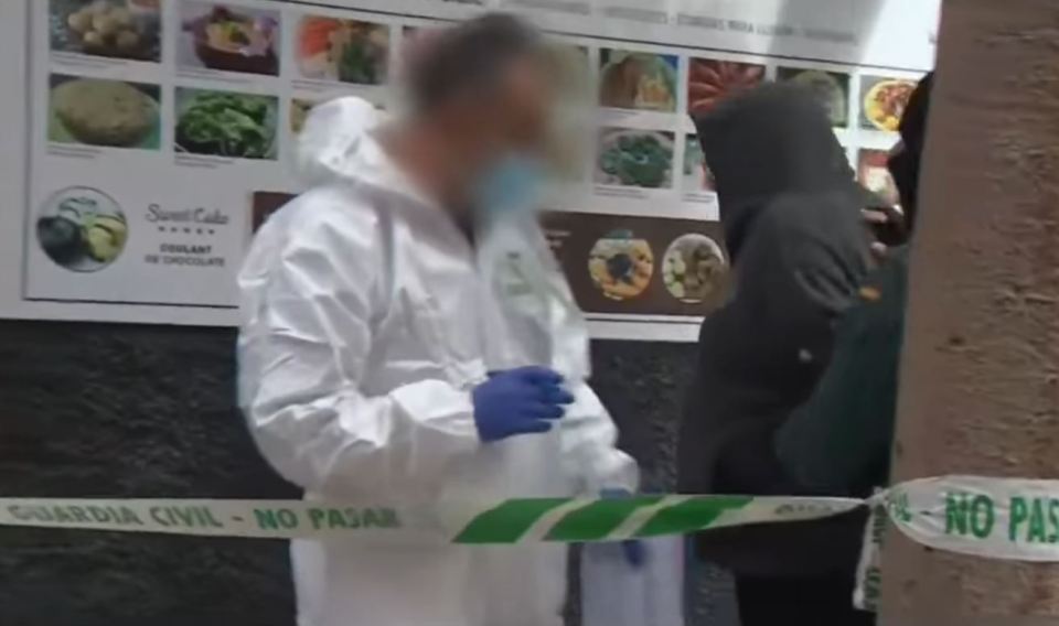 Crime scene with police and forensic investigators.