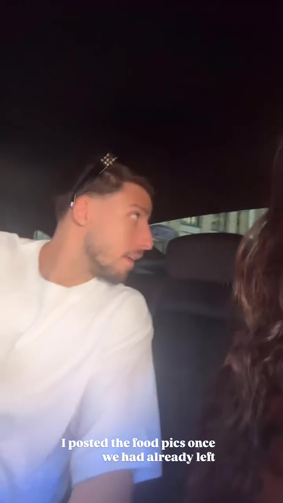 She filmed the footballer sitting behind her in the back of a cab