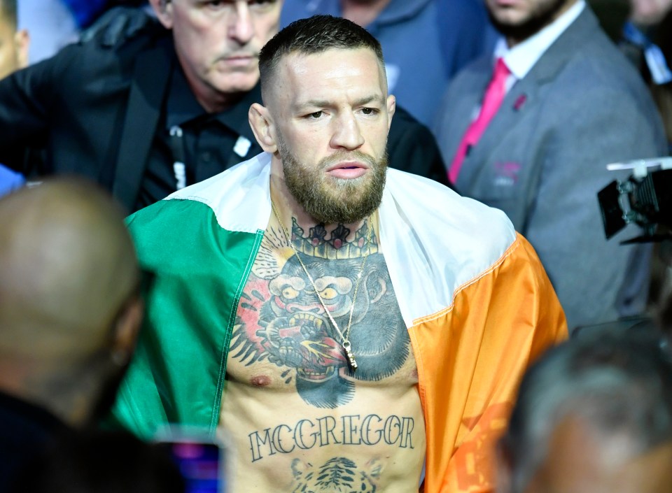 Conor McGregor draped in an Irish flag before a UFC fight.