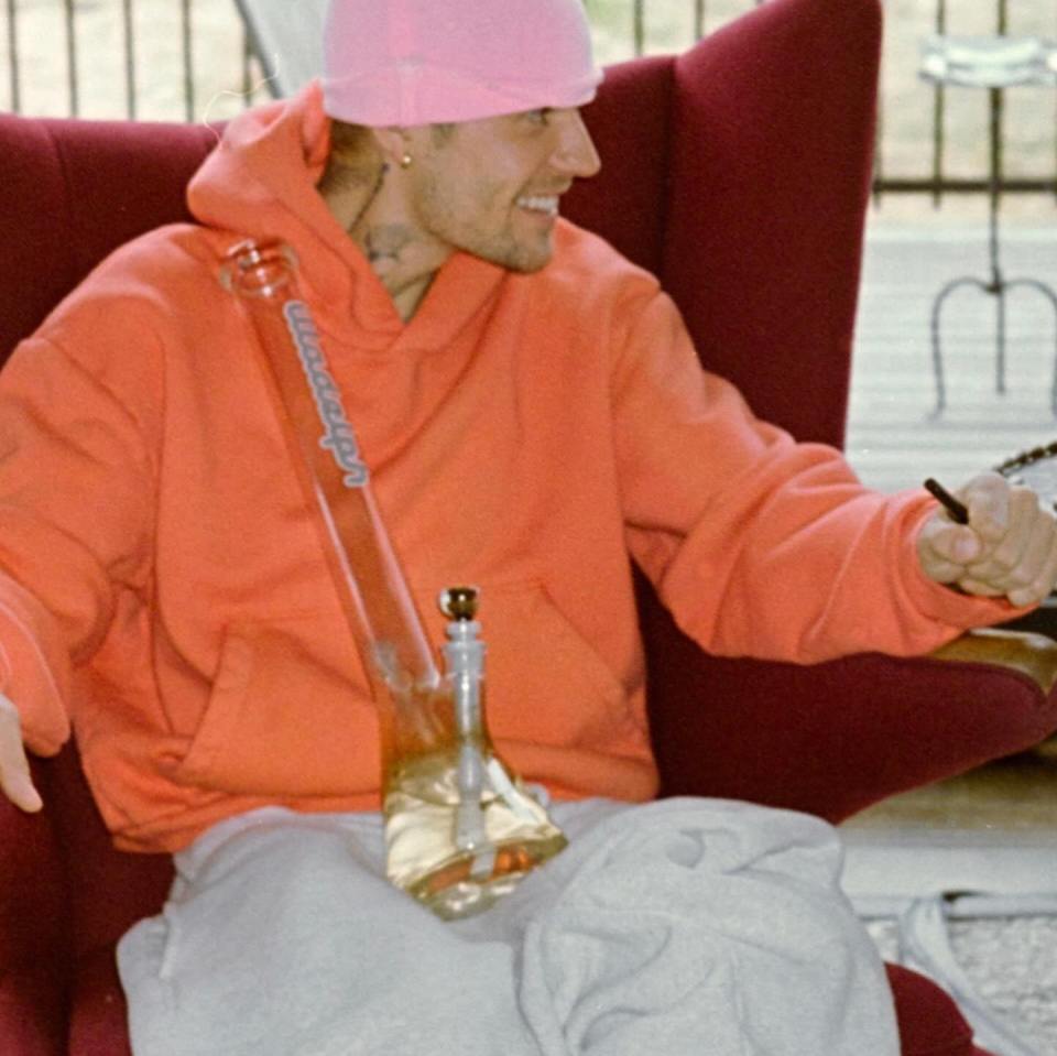 Justin Bieber holding a bong.
