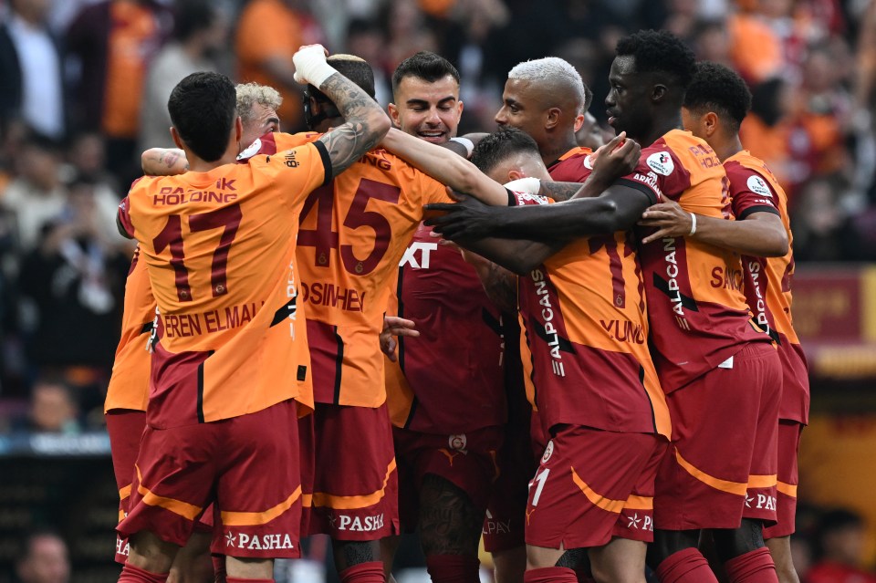 Galatasaray players celebrating a goal.