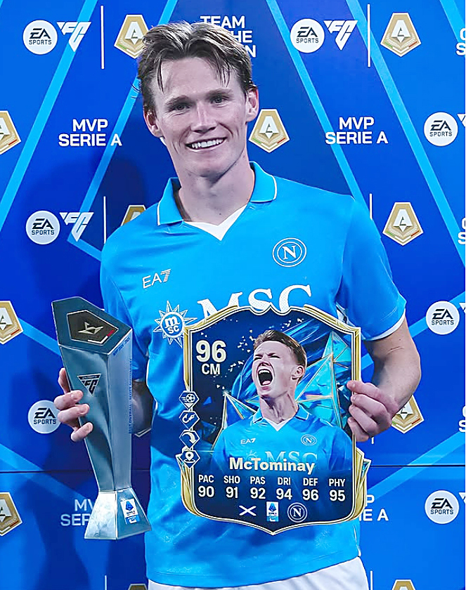 Scott McTominay holding Serie A MVP and Man of the Match awards.