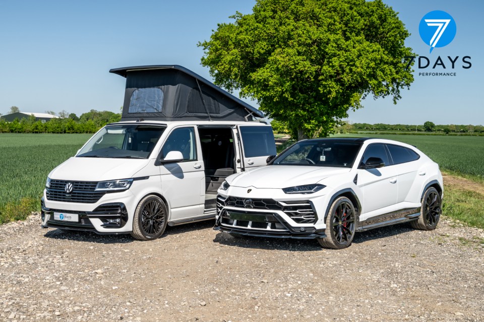 White camper van and Lamborghini Urus parked next to each other.