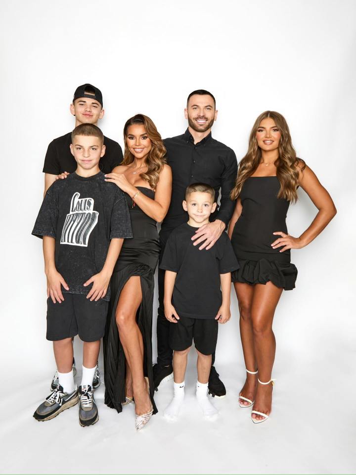 Family portrait of two adults and four children.