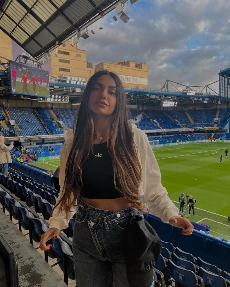 Woman at a soccer stadium.
