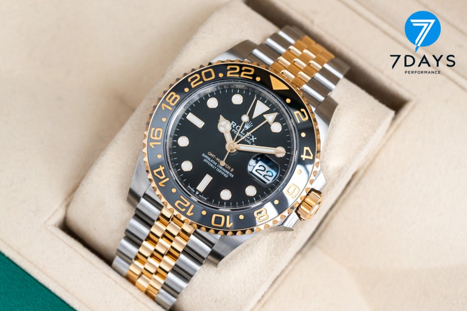 Rolex GMT-Master II watch with jubilee bracelet.
