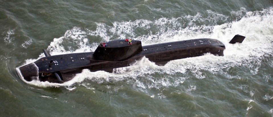 Aerial view of the HMS Astute submarine at sea.