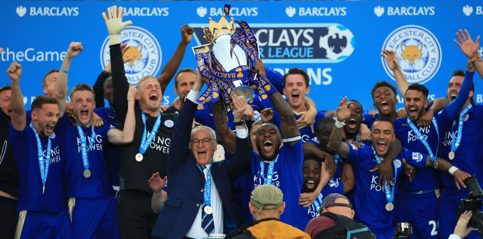 Claudio Ranieri holds aloft the Premier League trophy after a brilliant season