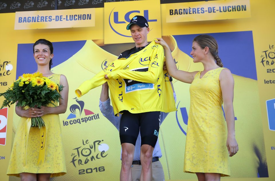 Chris Froome puts on the Yellow Jersey after taking the general classification lead on stage eight of the Tour de France