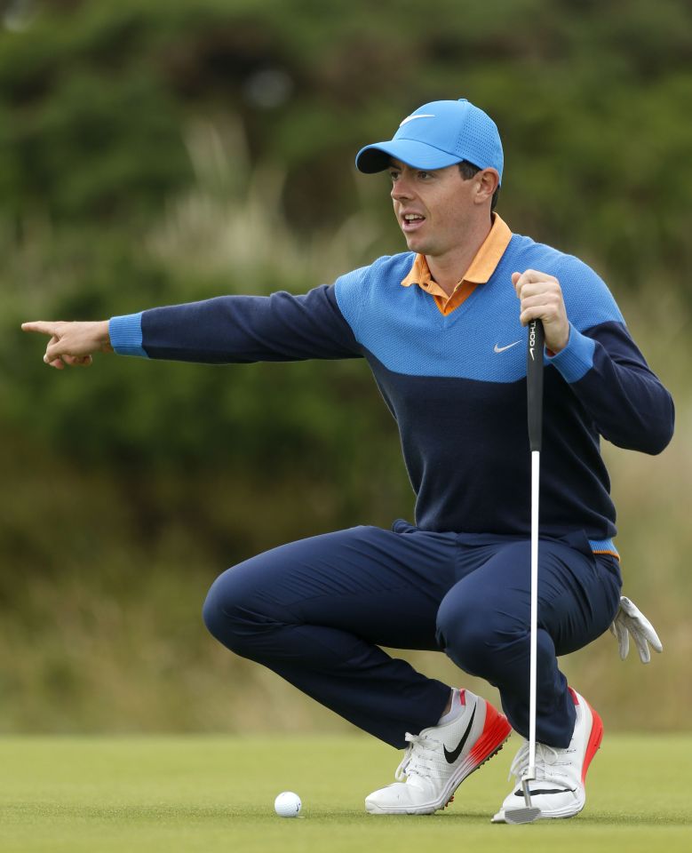 McIlroy lines up a putt on the 12th