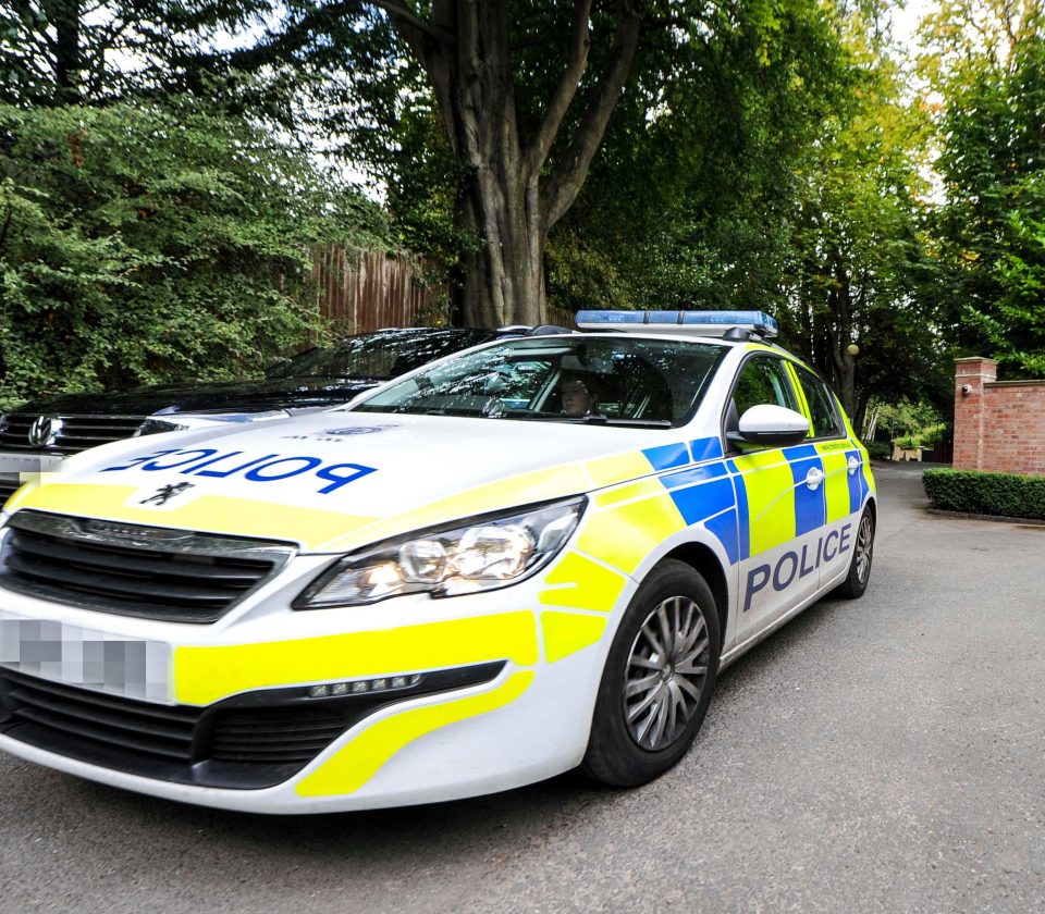  A police car sitting outside Wayne Rooney's house today