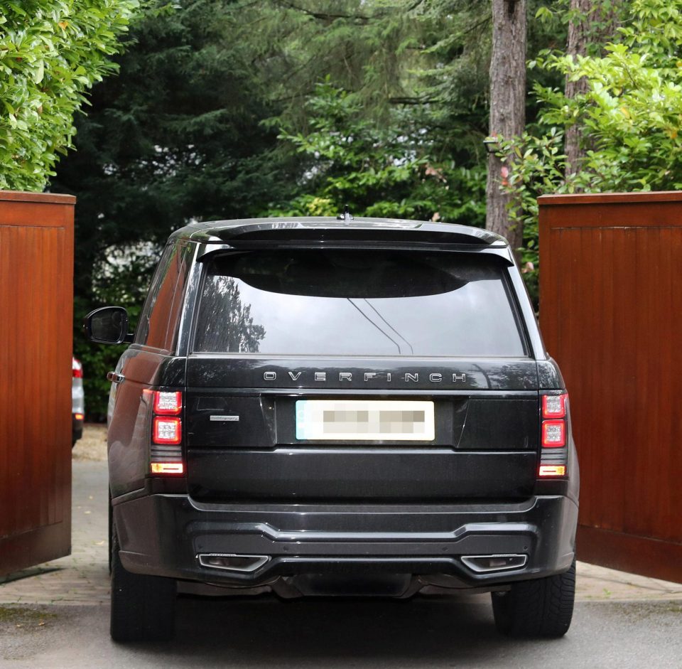  Rooney arrives home on Friday afternoon after being charged with drink driving