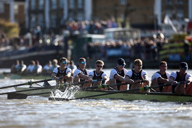 Rowing team competing in a boat race.
