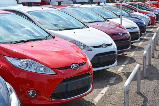 Row of Ford Fiestas on a car lot.