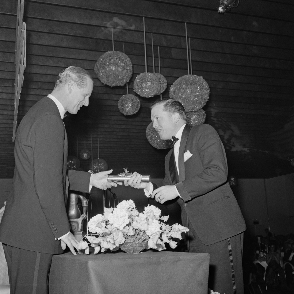 Prince Philip presents an award to British actor and producer Richard Attenborough (1923-2014)