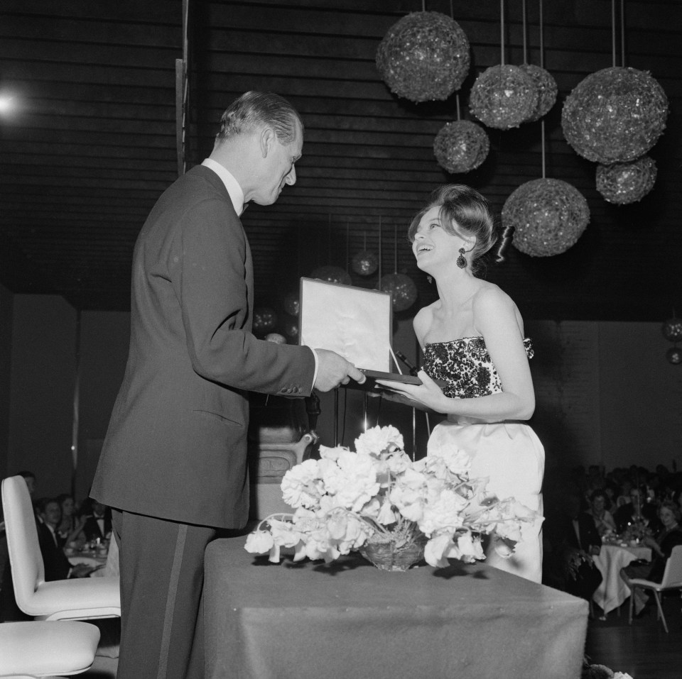 Prince Philip presents the Best British Actress award to French born actress Leslie Caron in 1963