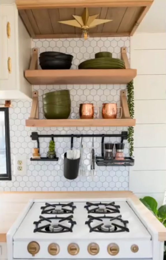 She added bronze handles to the kitchen cupboards and hob