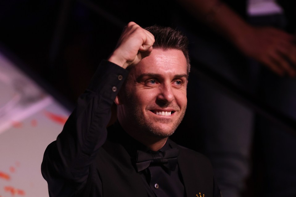 Mark Selby celebrating a 147 break at the World Snooker Championship.