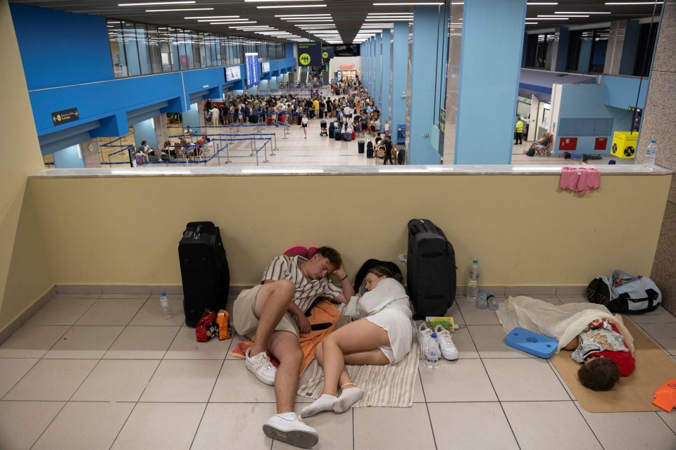 Evacuated tourists are being forced to sleep on the airport floor in Rhodes