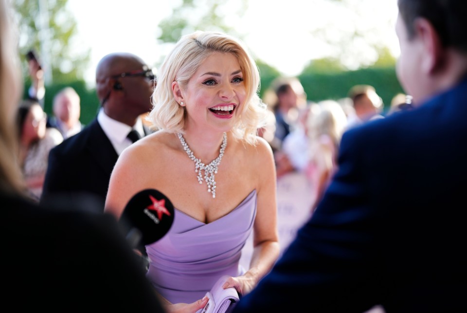 Holly 'boldly' engaged with journalists on the red carpet