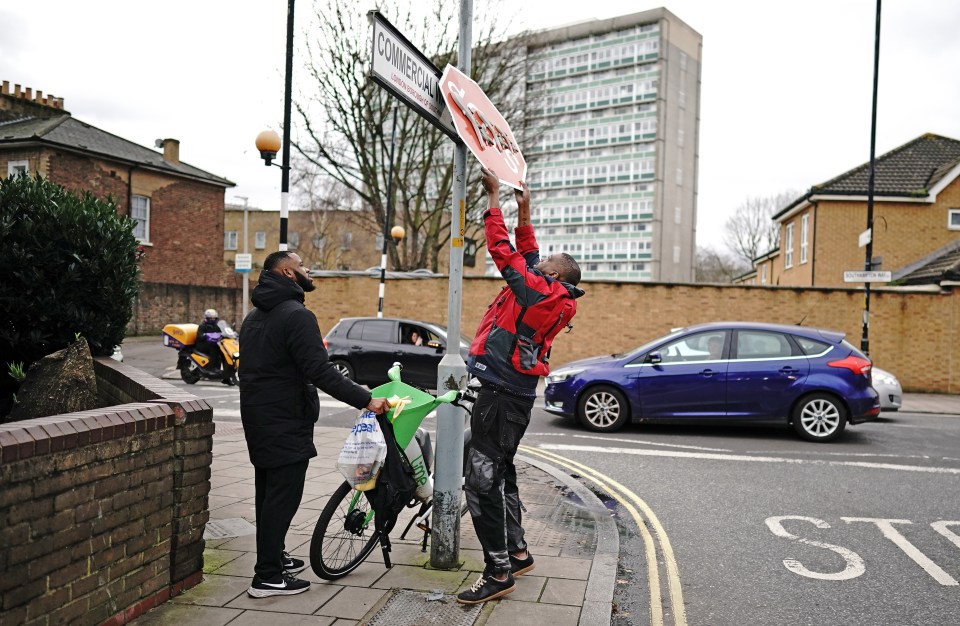 Two men removed the sign