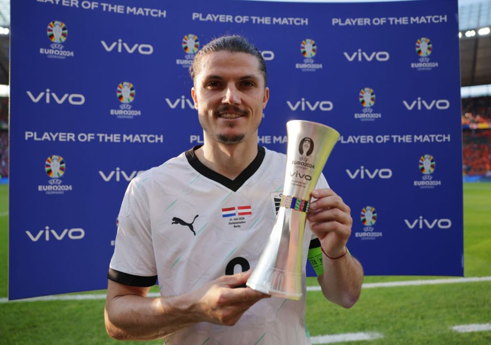 BERLIN, GERMANY - JUNE 25: Marcel Sabitzer of Austria poses for a photo with the Vivo Player of the Match award after the team's victory and qualification to the knockout stages in the UEFA EURO 2024 group stage match between Netherlands and Austria at Olympiastadion on June 25, 2024 in Berlin, Germany. (Photo by Maja Hitij - UEFA/UEFA via Getty Images)