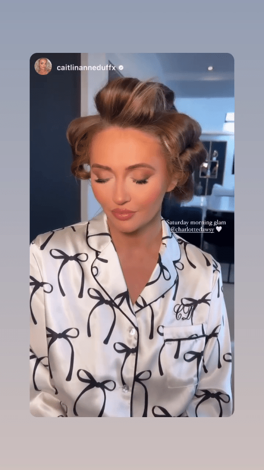 Charlotte, 31, looked glam in rollers and a full face of make-up