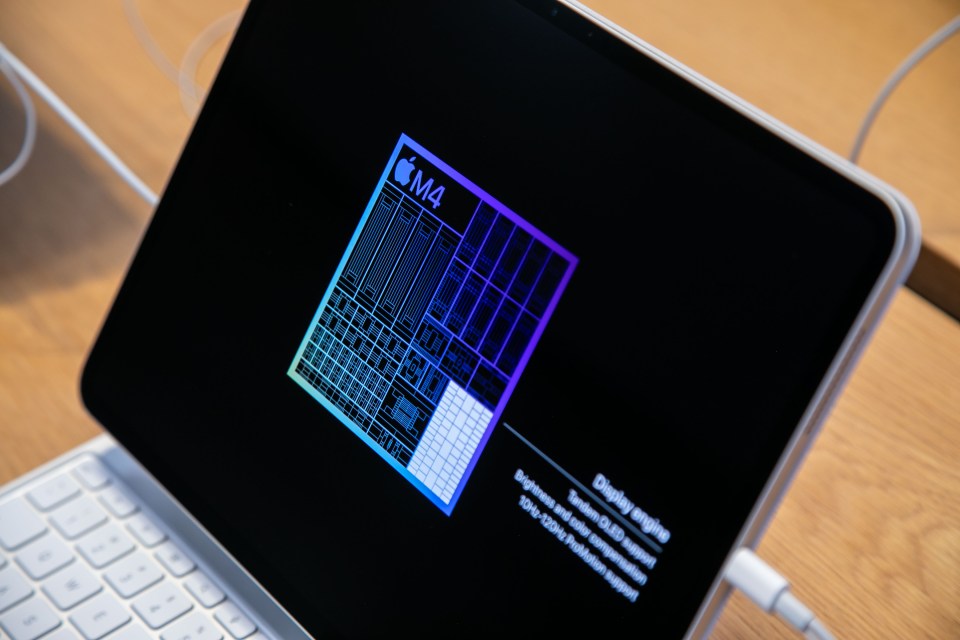 an apple m4 processor is displayed on a laptop