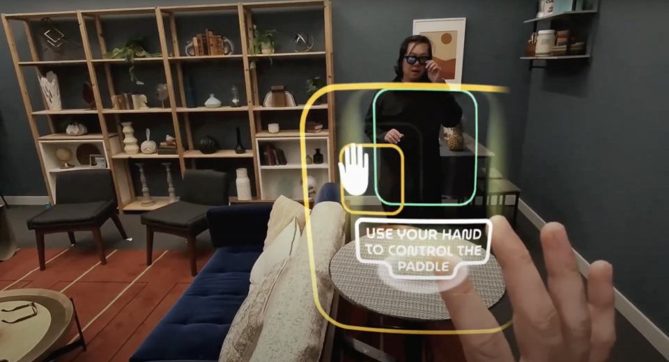 a person is using their hand to control a paddle