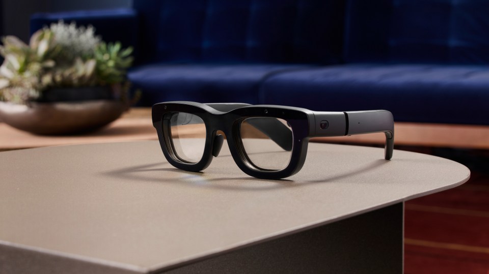a pair of glasses sitting on top of a table